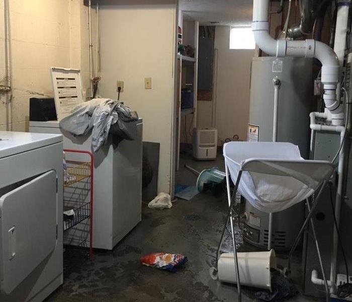 Laundry room flooded after storm, sitting water